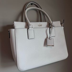 White Kate Spade handbag with black and white stripe interior
